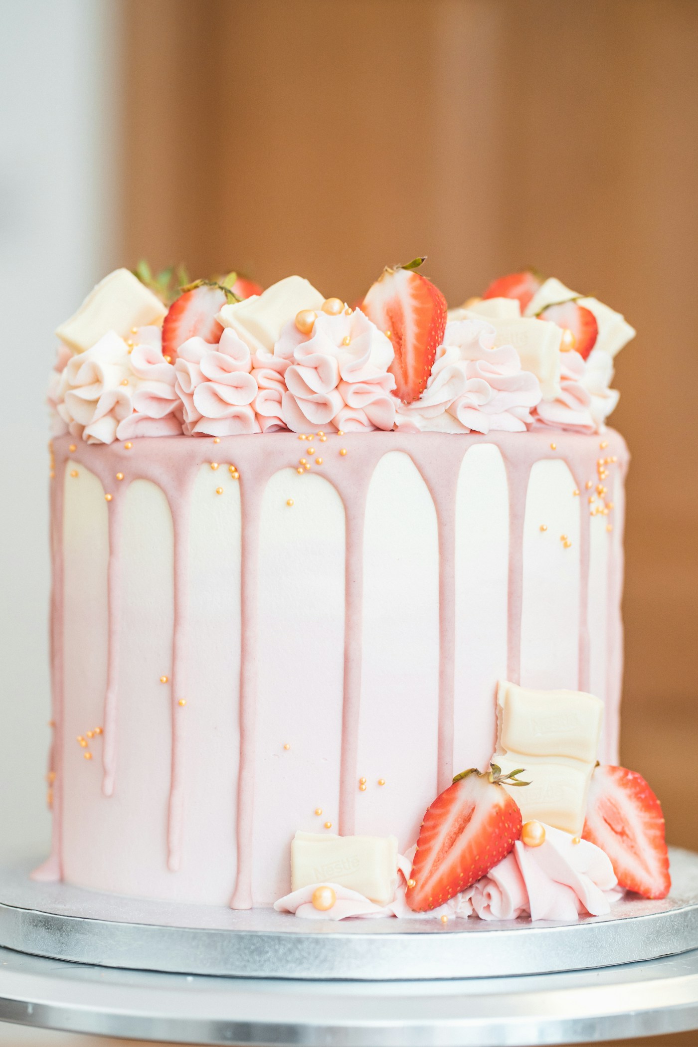 Illustrative stock photograph of a pink strawberry cake; not Sugar and Whisk's work